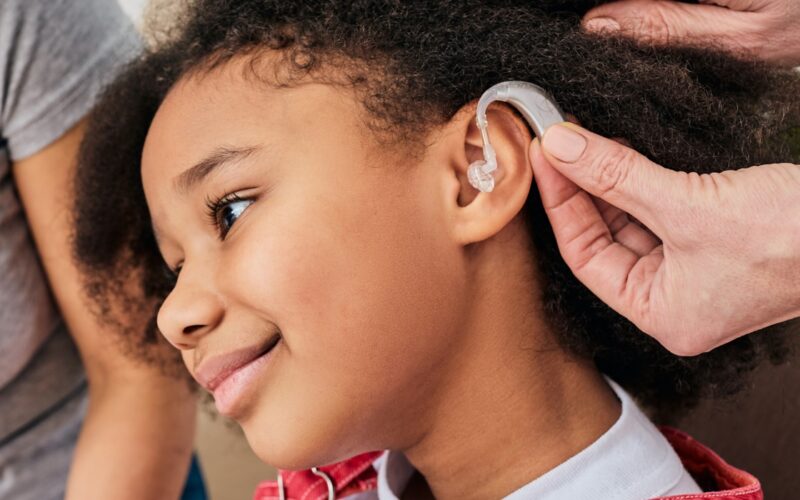Hearing aid fitted on a smiling child 2026 03 24 03 23 31 utc 1440x700