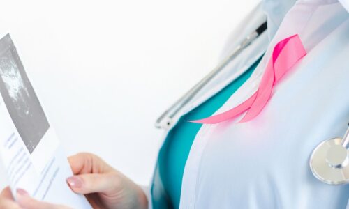 Woman doctor examining scan with pink ribbon 2026 09 24 07 24 37 utc 1