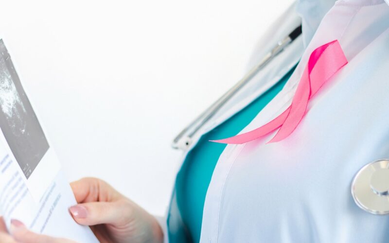 Woman doctor examining scan with pink ribbon 2026 09 24 07 24 37 utc 1
